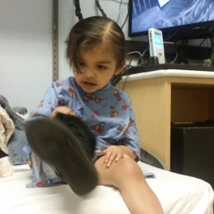 My'isha thinks she is ready to go. Although, she is only going down for scans and she is putting the shoe on the wrong foot.